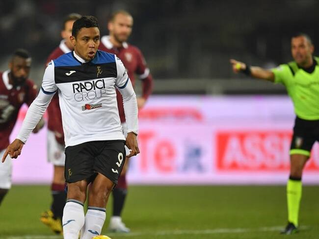 los colombianos Duván Zapata (45+1, penal) y Luis Muriel (86 penal y 88). Foto: Getty Images