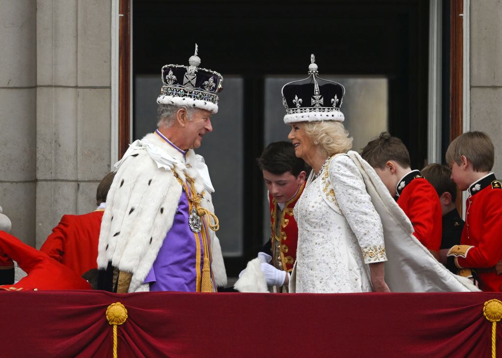 LONDON, ENGLAND - MAY 06: King Charles III and Queen Camilla can be seen on the Buckingham Palace balcony during the Coronation of King Charles III and Queen Camilla on May 06, 2023 in London, England. The Coronation of Charles III and his wife, Camilla, as King and Queen of the United Kingdom of Great Britain and Northern Ireland, and the other Commonwealth realms takes place at Westminster Abbey today. Charles acceded to the throne on 8 September 2022, upon the death of his mother, Elizabeth II. (Photo by Brandon Bell/Getty Images)