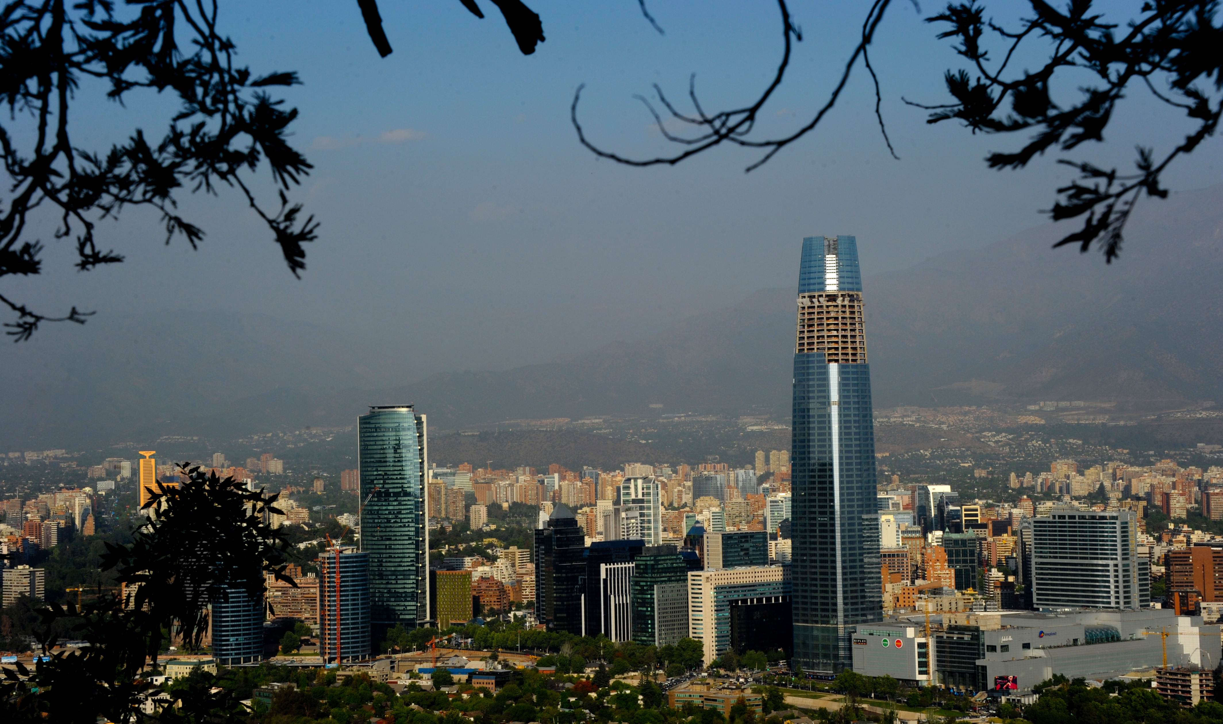 TO GO WITH Chile-architecture-business,FEATURE by Paulina AbramovichView of the Gran Torre Costanera Center building under construction (R), the tallest in South America, in Santiago, on November 20, 2012.  The 300-metre-high tower was designed by Argentine architect Cesar Pelli, who designed the Petronas Towers in Kuala Lumpur.   AFP PHOTO/MARTIN BERNETTI / AFP PHOTO / MARTIN BERNETTI        (Photo credit should read MARTIN BERNETTI/AFP via Getty Images)