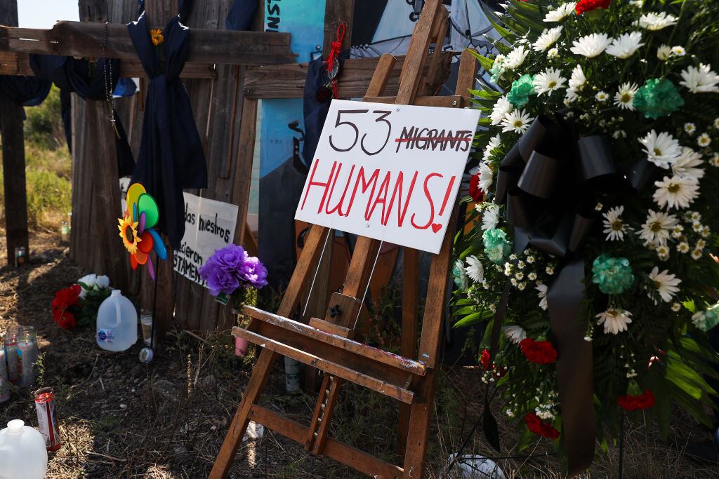 SAN ANTONIO, TEXAS - JUNE 29:  People visit and commemorate as they leave flowers, candles and water, where dozens of dead migrants found in a truck in San Antonio, Texas, United States on June 29, 2022. The number of dead migrants found in a tractor-trailer rises to 53. (Photo by Tayfun Coskun/Anadolu Agency via Getty Images)