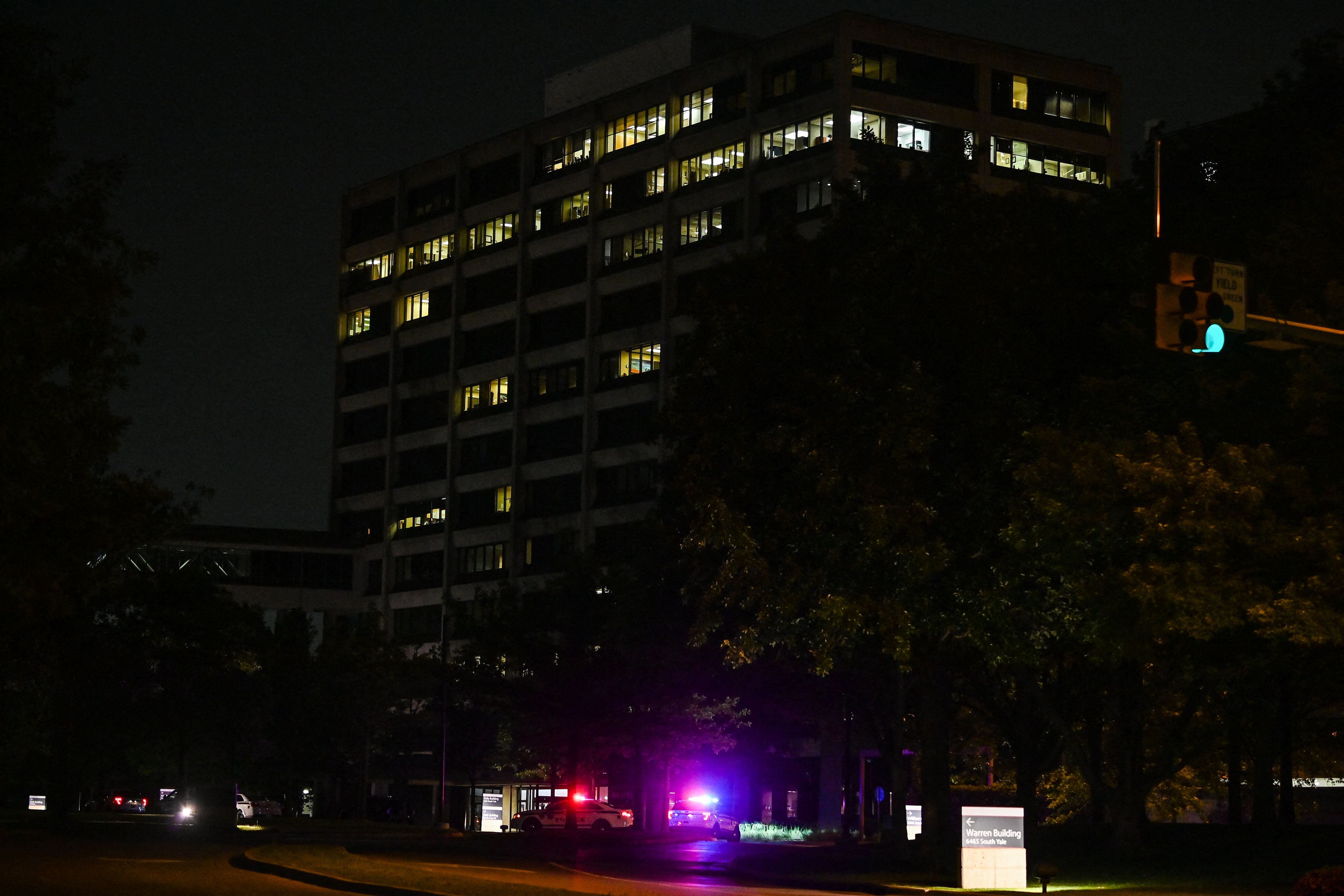 Tulsa police cars block the entrance of the Natalie Medical Building at Saint Francis Hospital campus in Tulsa, Oklahoma, on June 1, 2022. - A gunman killed at least four people Wednesday at a hospital campus in Tulsa, Oklahoma, police said, the latest mass shooting to convulse America coming as Texas families bury their dead after a school massacre barely one week ago.The suspect, who was armed with a rifle and a handgun, was also killed in the attack at the St. Francis Health System hospital campus, police said. (Photo by CHANDAN KHANNA / AFP) (Photo by CHANDAN KHANNA/AFP via Getty Images)