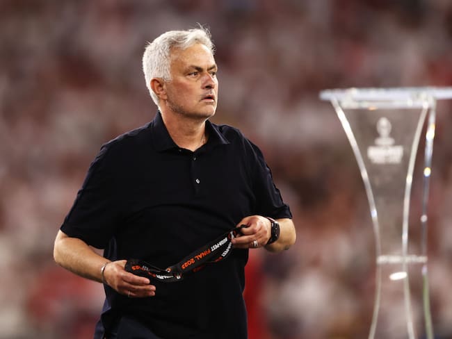 BUDAPEST, HUNGARY - MAY 31: Jose Mourinho, Head Coach of AS Roma, removes their runners up medal after collecting it from Aleksander Ceferin, President of UEFA, (not pictured) after defeat to Sevilla FC in the penalty shoot out during the UEFA Europa League 2022/23 final match between Sevilla FC and AS Roma at Puskas Arena on May 31, 2023 in Budapest, Hungary. (Photo by Naomi Baker/Getty Images)