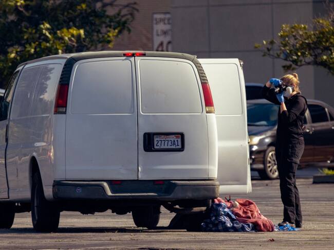 TORRANCE PARK, CA - JANUARY 22: An investigator photographs a van at the scene of a S.W.A.T. operation on January 22, 2023 in Torrance, California. Armored vehicles were used to entrap a vehicle driven by a suspect in a mass shooting in Monterey Park, east of Los Angeles. 10 people were killed and 10 more were injured at a dance studio in Monterey Park near a Lunar New Year celebration last night. (Photo by David McNew/Getty Images)