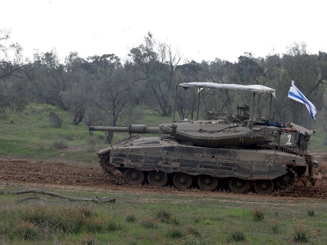 Undisclosed (Israel), 28/01/2024.- An Israeli Merkava tank from the Reserve Brigade 4 is seen at a gathering location before being loaded on trucks after they pulled out from southern Gaza Strip, at an undisclosed location in Israel, 28 January 2024. More than 26,200 Palestinians and at least 1,330 Israelis have been killed, according to the Palestinian Health Ministry and the Israel Defense Forces (IDF), since Hamas militants launched an attack against Israel from the Gaza Strip on 07 October 2023, and the Israeli operations in Gaza and the West Bank which followed it. EFE/EPA/ATEF SAFADI