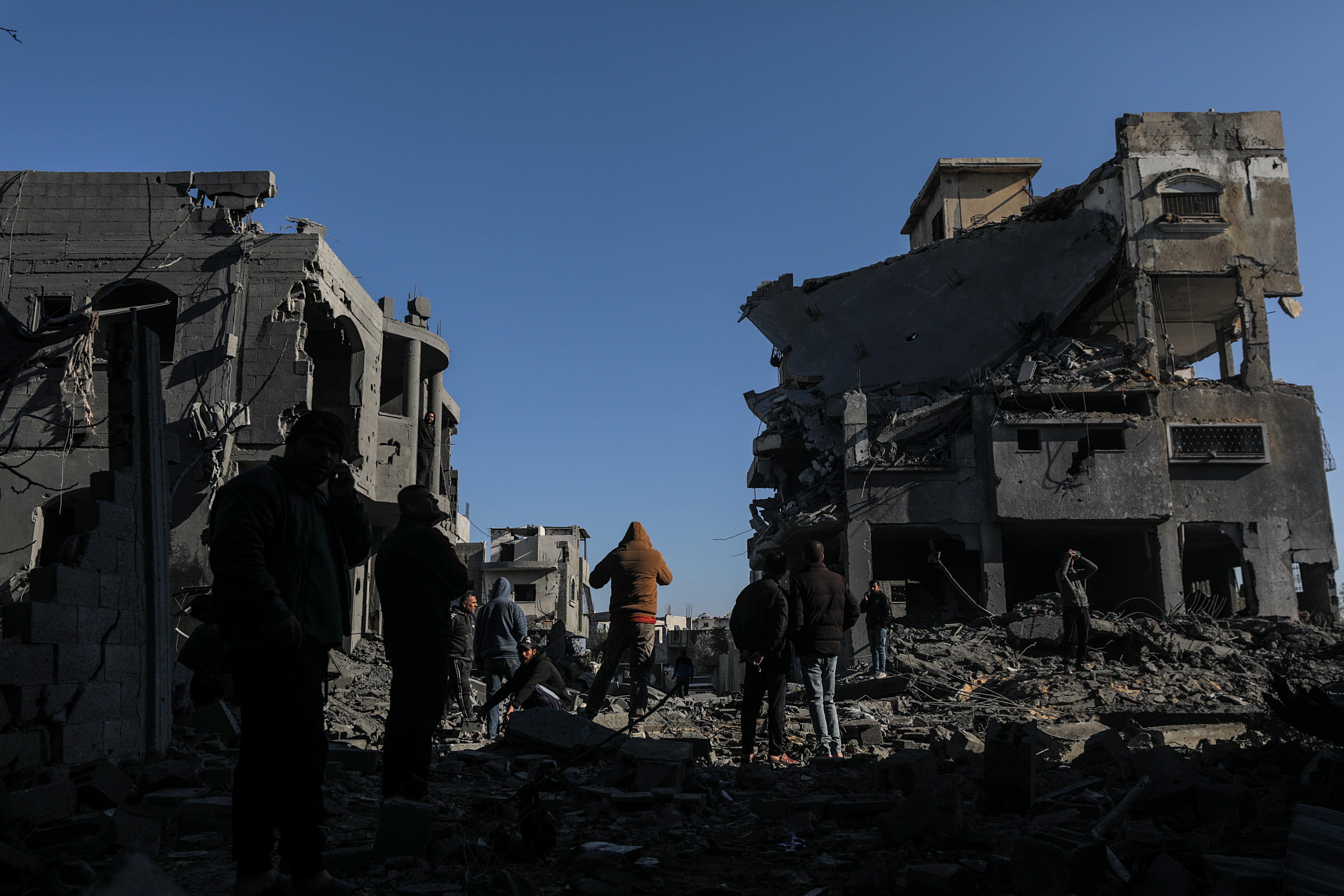 Al Maghazi Refugee Camp (---), 03/01/2025.- Palestinians inspect the destroyed house of the Abu Libda family following an Israeli air strike in Al Maghazi refugee camp, central Gaza Strip, 03 January 2025. According to reports from the Ministry of Health in Gaza at least nine members of the Abu Libda family were killed following an Israeli air strike in the refugee camp. More than 45,500 Palestinians and over 1,400 Israelis have been killed, according to the Palestinian Health Ministry and the Israeli Army, since Hamas militants launched an attack against Israel from the Gaza Strip on 07 October 2023 and the Israeli operations in Gaza and the West Bank that followed it. EFE/EPA/MOHAMMED SABER