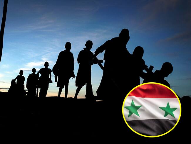 Migración y bandera de Siria. I Foto: Getty Images.