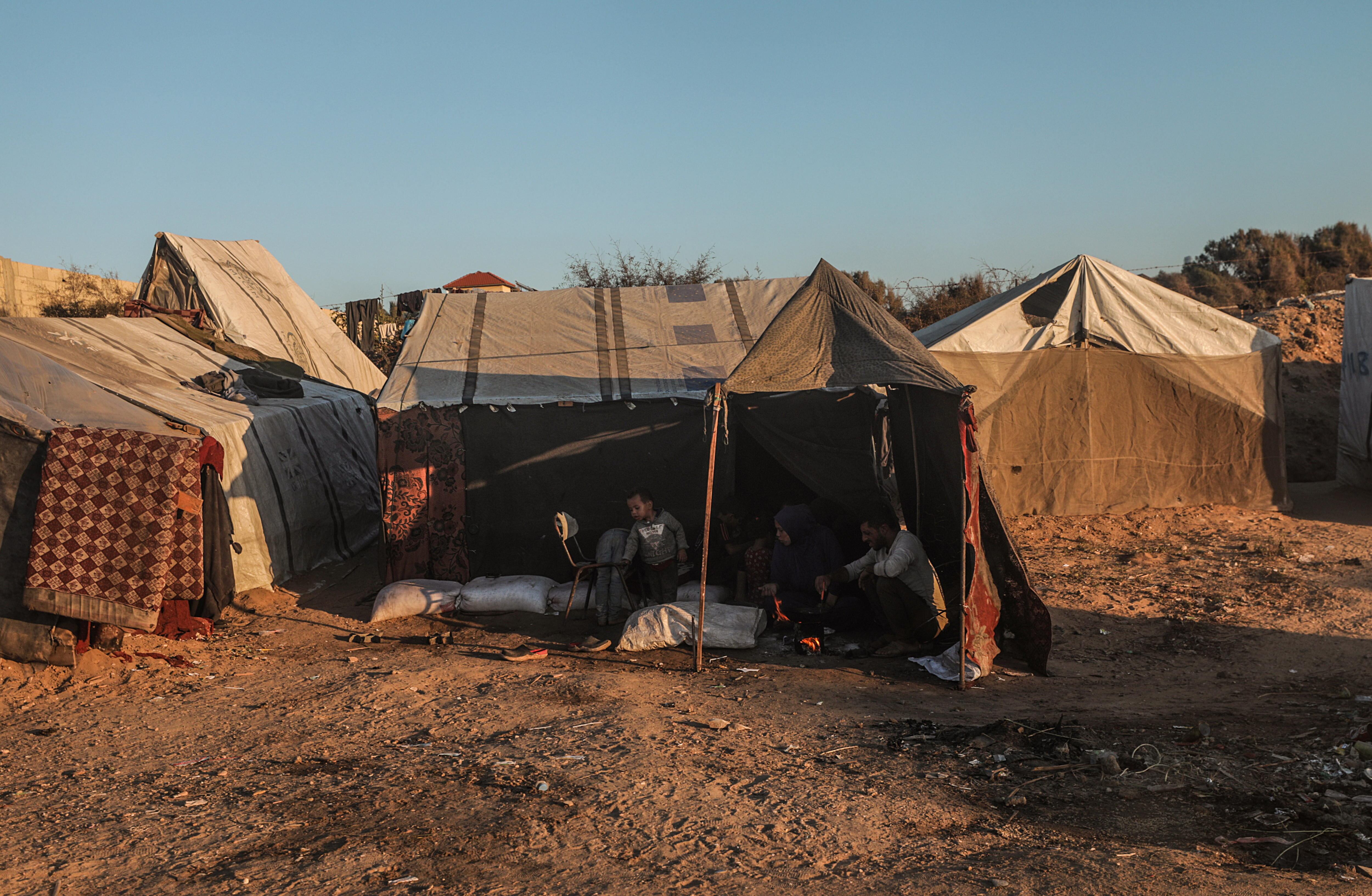Al Nuseirat (---), 12/10/2024.- An internally displaced Palestinian family sit inside their tent at the Al Nuseirat refugee camp, southern Gaza Strip, 12 October 2024. More than 42,500 Palestinians and over 1,400 Israelis have been killed, according to the Palestinian Health Ministry and the Israel Defense Forces (IDF), since Hamas militants launched an attack against Israel from the Gaza Strip on 07 October 2023, and the Israeli operations in Gaza and the West Bank which followed it. EFE/EPA/MOHAMMED SABER