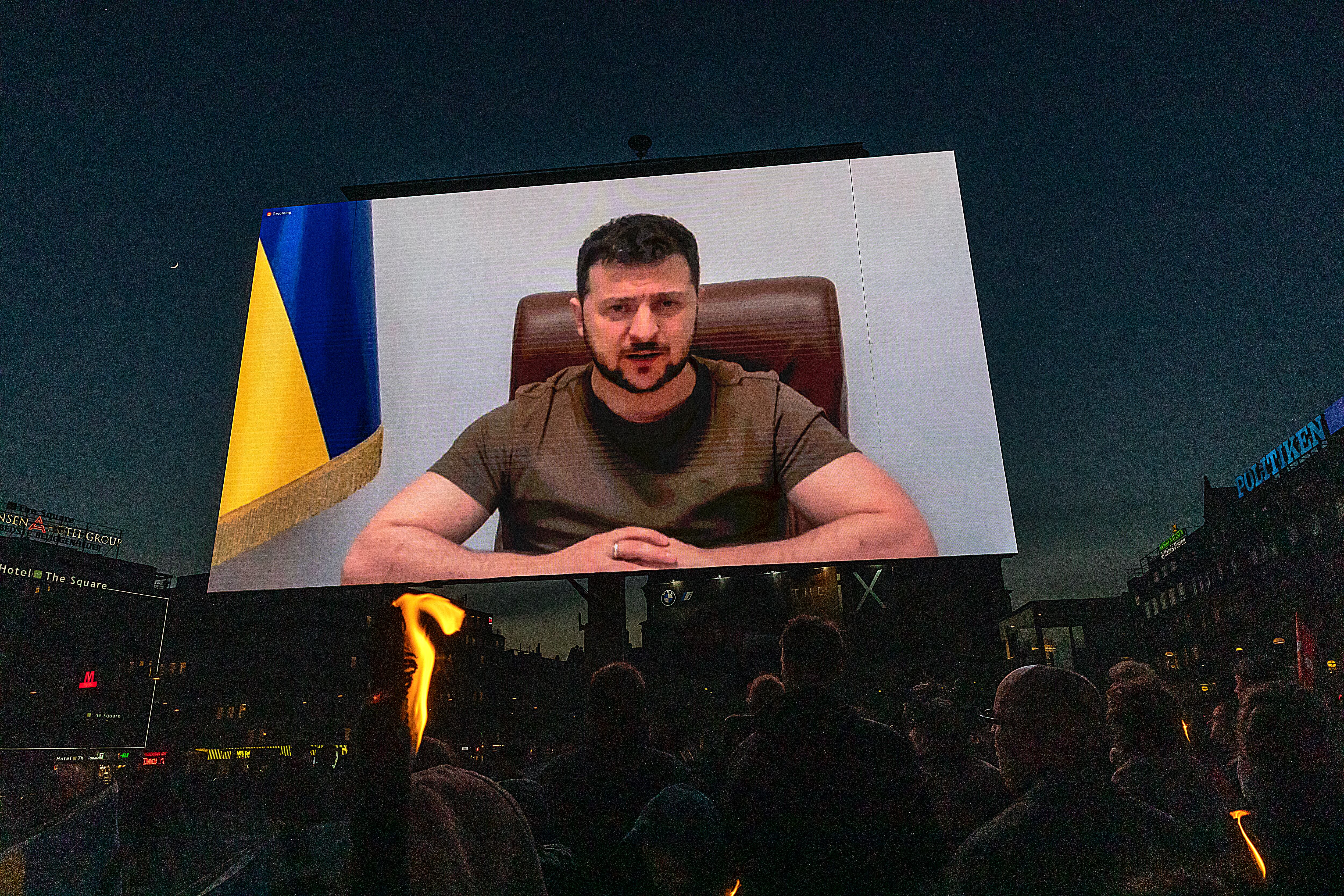 COPENHAGEN, DENMARK - MAY 04: To commemorate Danish World War II Liberation Day, Danes traditionally place candles by their windows, this year Ukrainian President Zelensky addresses Danes via video projected on large screens at Copenhagen City Hall Square. (Photo by Ole Jensen/Getty Images)