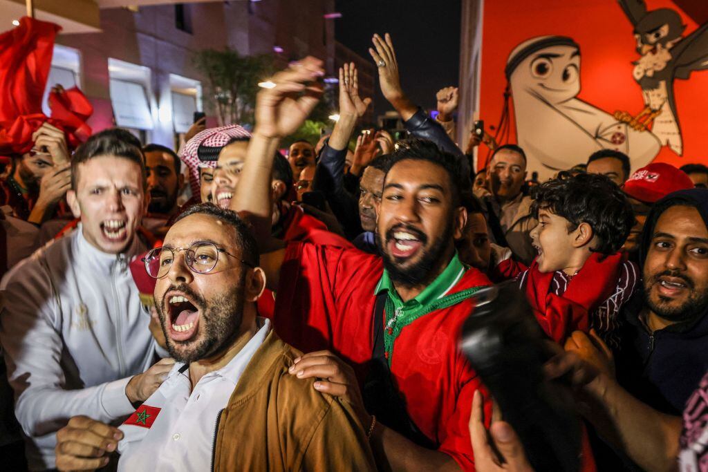 Morocco fans celebrate  (Photo by MAHMUD HAMS / AFP) (Photo by MAHMUD HAMS/AFP via Getty Images)