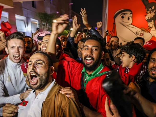 Morocco fans celebrate (Photo by MAHMUD HAMS / AFP) (Photo by MAHMUD HAMS/AFP via Getty Images)