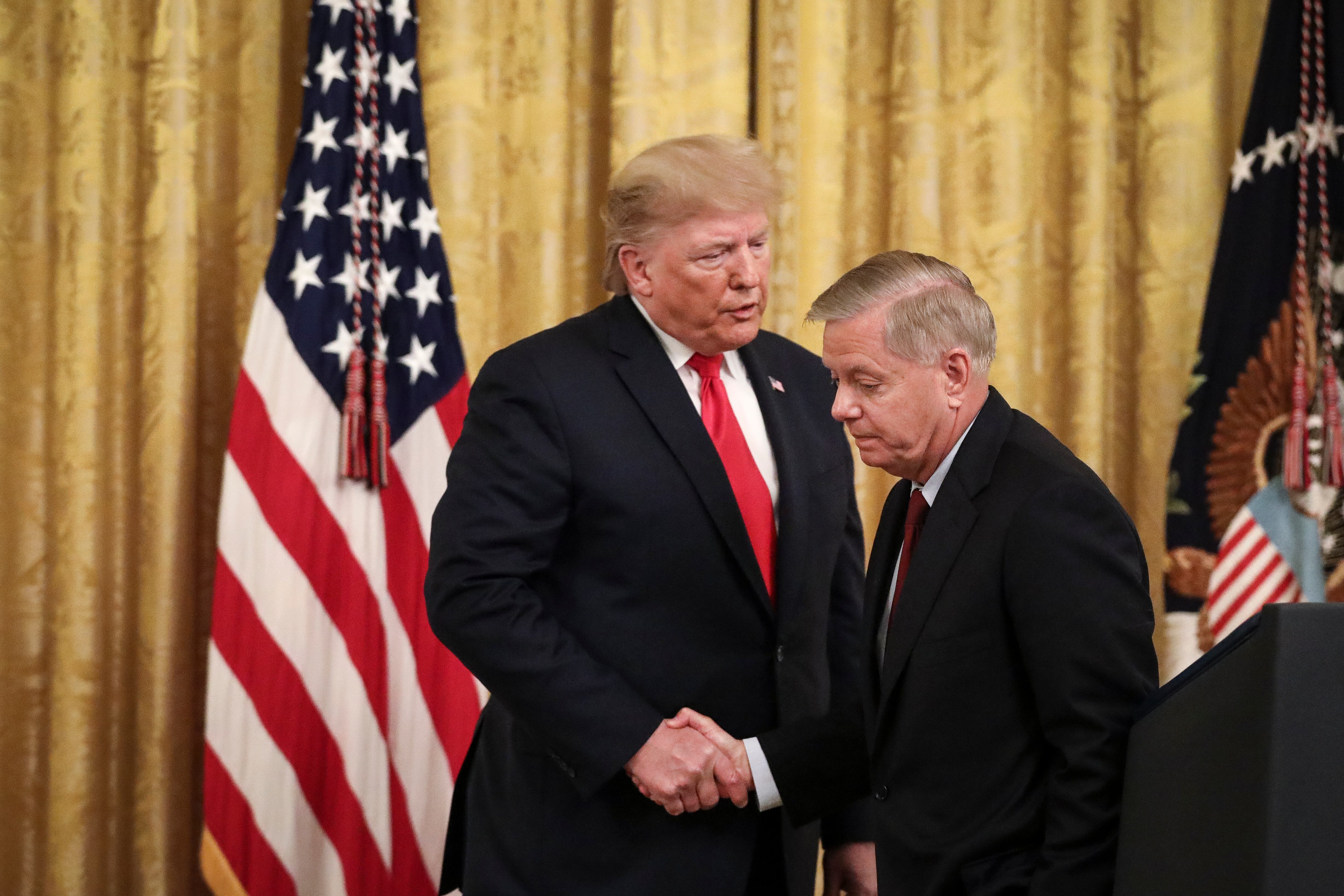 Donald Trump y Lindsey Graham. (Photo by Drew Angerer/Getty Images)