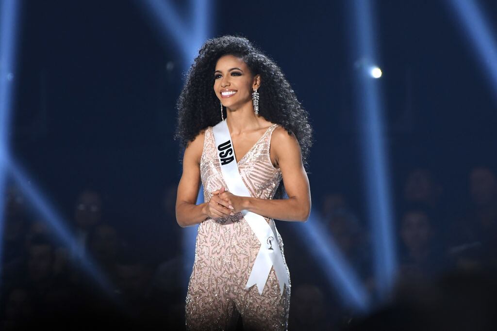 ATLANTA, GEORGIA - DECEMBER 08: (EDITORIAL USE ONLY) Miss USA Cheslie Kryst appears onstage at the 2019 Miss Universe Pageant at Tyler Perry Studios on December 08, 2019 in Atlanta, Georgia. (Photo by Paras Griffin/Getty Images)