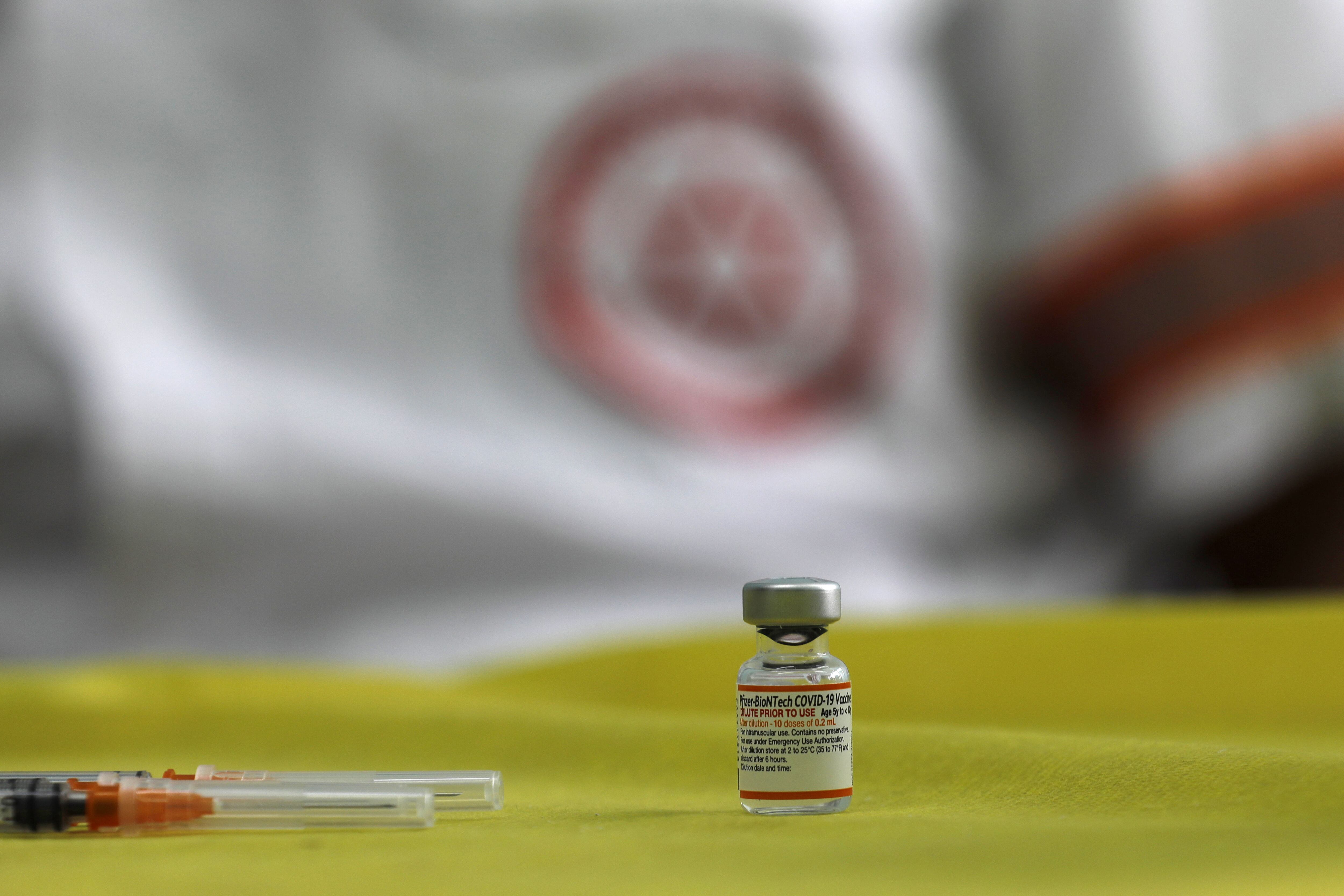A picture shows a vial of the Pfizer/BioNTech Covid-19 vaccine during a vaccination drive at the al-Manahel School in the Druze village of Majdal Shams in the Israel-annexed Golan Heights, on December 12, 2021. (Photo by JALAA MAREY / AFP) (Photo by JALAA MAREY/AFP via Getty Images)