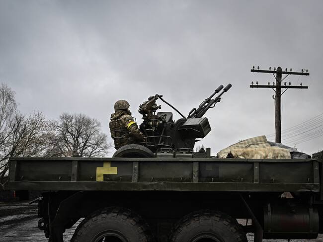 An Ukrainian soldier keeps position sitting on a ZU-23-2 anti-aircraft gun at a frontline, northeast of Kyiv on March 3, 2022. - A Ukrainian negotiator headed for ceasefire talks with Russia said on March 3, 2022, that his objective was securing humanitarian corridors, as Russian troops advance one week into their invasion of the Ukraine. (Photo by Aris Messinis / AFP) (Photo by ARIS MESSINIS/AFP via Getty Images)