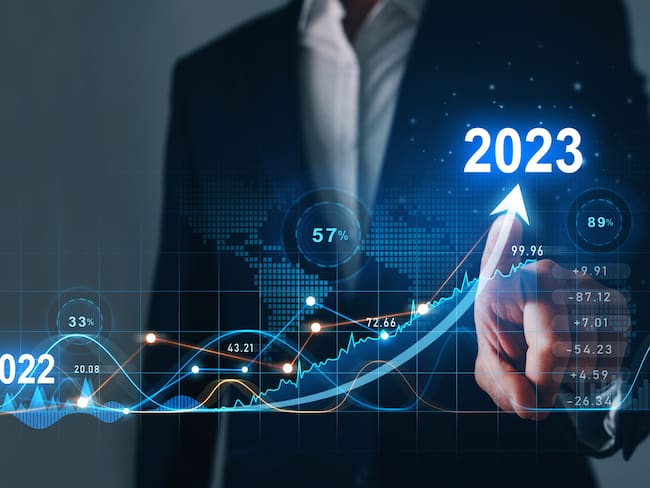 Businessman draws increase arrow graph corporate future growth year 2022 to 2023. Planning,opportunity, challenge and business strategy. New Goals, Plans and Visions for Next Year 2023