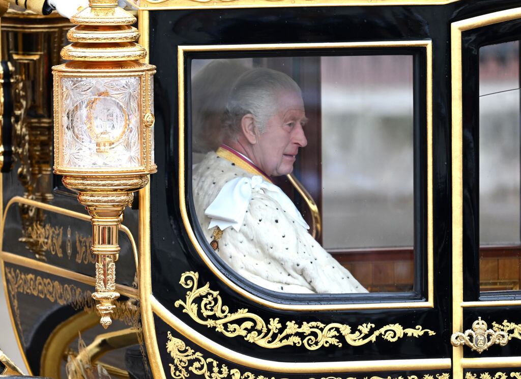 LONDON, ENGLAND - MAY 06: King Charles III and Camilla, Queen Consort travelling in the Diamond Jubilee Coach built in 2012 to commemorate the 60th anniversary of the reign of Queen Elizabeth II, flanked by over a thousand Armed Forces route liners and The Sovereign’s Escort of the Household Cavalry sets off along the Mall from Buckingham Palace on route to Westminster Abbey for the Coronation of King Charles III and Queen Camilla on May 06, 2023 in London, England. The Coronation of Charles III and his wife, Camilla, as King and Queen of the United Kingdom of Great Britain and Northern Ireland, and the other Commonwealth realms takes place at Westminster Abbey today. Charles acceded to the throne on 8 September 2022, upon the death of his mother, Elizabeth II. (Photo by Samir Hussein/WireImage)
