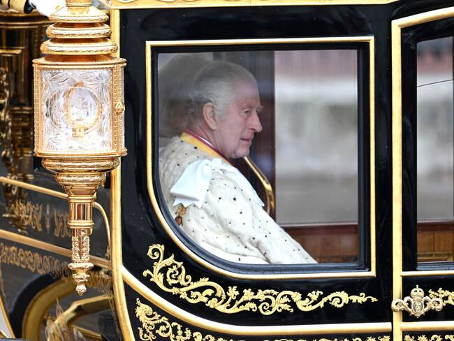 LONDON, ENGLAND - MAY 06: King Charles III and Camilla, Queen Consort travelling in the Diamond Jubilee Coach built in 2012 to commemorate the 60th anniversary of the reign of Queen Elizabeth II, flanked by over a thousand Armed Forces route liners and The Sovereign’s Escort of the Household Cavalry sets off along the Mall from Buckingham Palace on route to Westminster Abbey for the Coronation of King Charles III and Queen Camilla on May 06, 2023 in London, England. The Coronation of Charles III and his wife, Camilla, as King and Queen of the United Kingdom of Great Britain and Northern Ireland, and the other Commonwealth realms takes place at Westminster Abbey today. Charles acceded to the throne on 8 September 2022, upon the death of his mother, Elizabeth II. (Photo by Samir Hussein/WireImage)