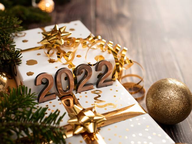 Hello 2022 alphabet letter with cotton ball LED decoration on wooden background.