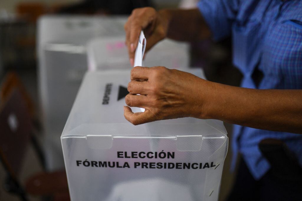 A man casts his vote at a polling station during general elections, in Tegucigalpa, on November 28, 2021. - Honduras braced for potential violence as polls opened on Sunday to elect a new president to replace Juan Orlando Hernandez, a controversial figure accused of drug trafficking in the United States. (Photo by LUIS ACOSTA / AFP) (Photo by LUIS ACOSTA/AFP via Getty Images)