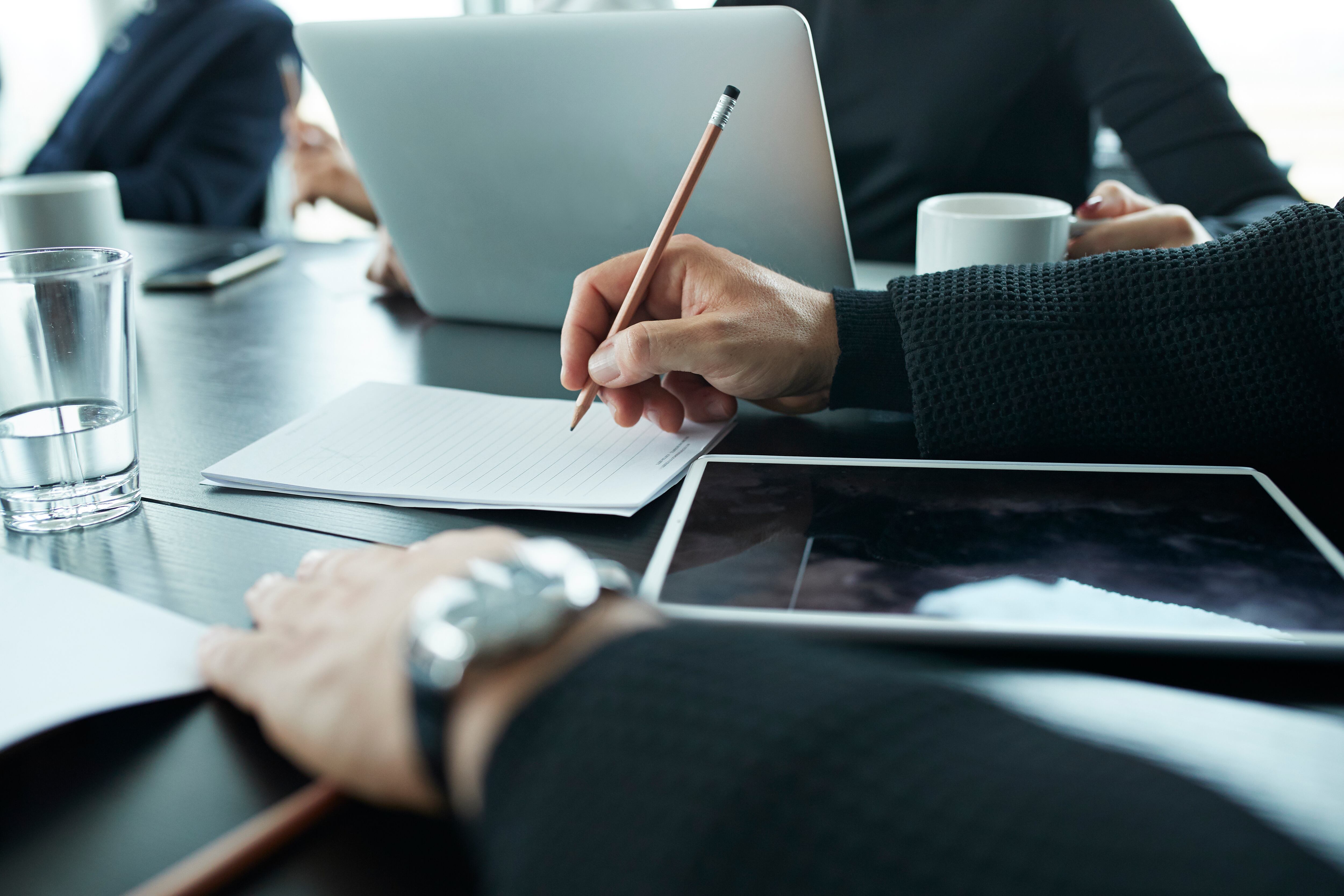 Business people in large modern meeting room