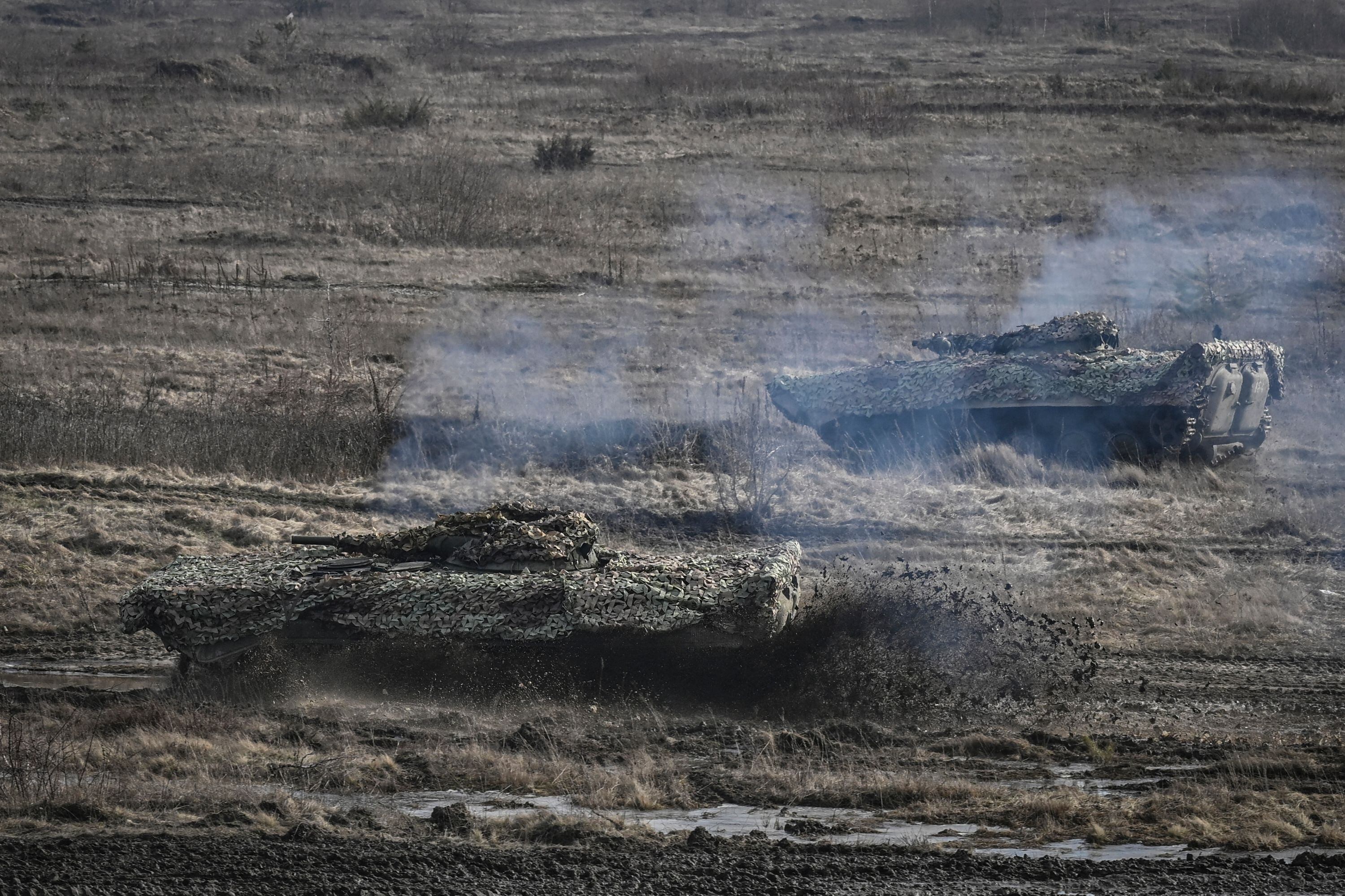 Ukrainian Army T-64 tanks take part in a military drill outside the city of Rivne, northern Ukraine, on February 16, 2022. (Photo by Aris Messinis / AFP) (Photo by ARIS MESSINIS/AFP via Getty Images)