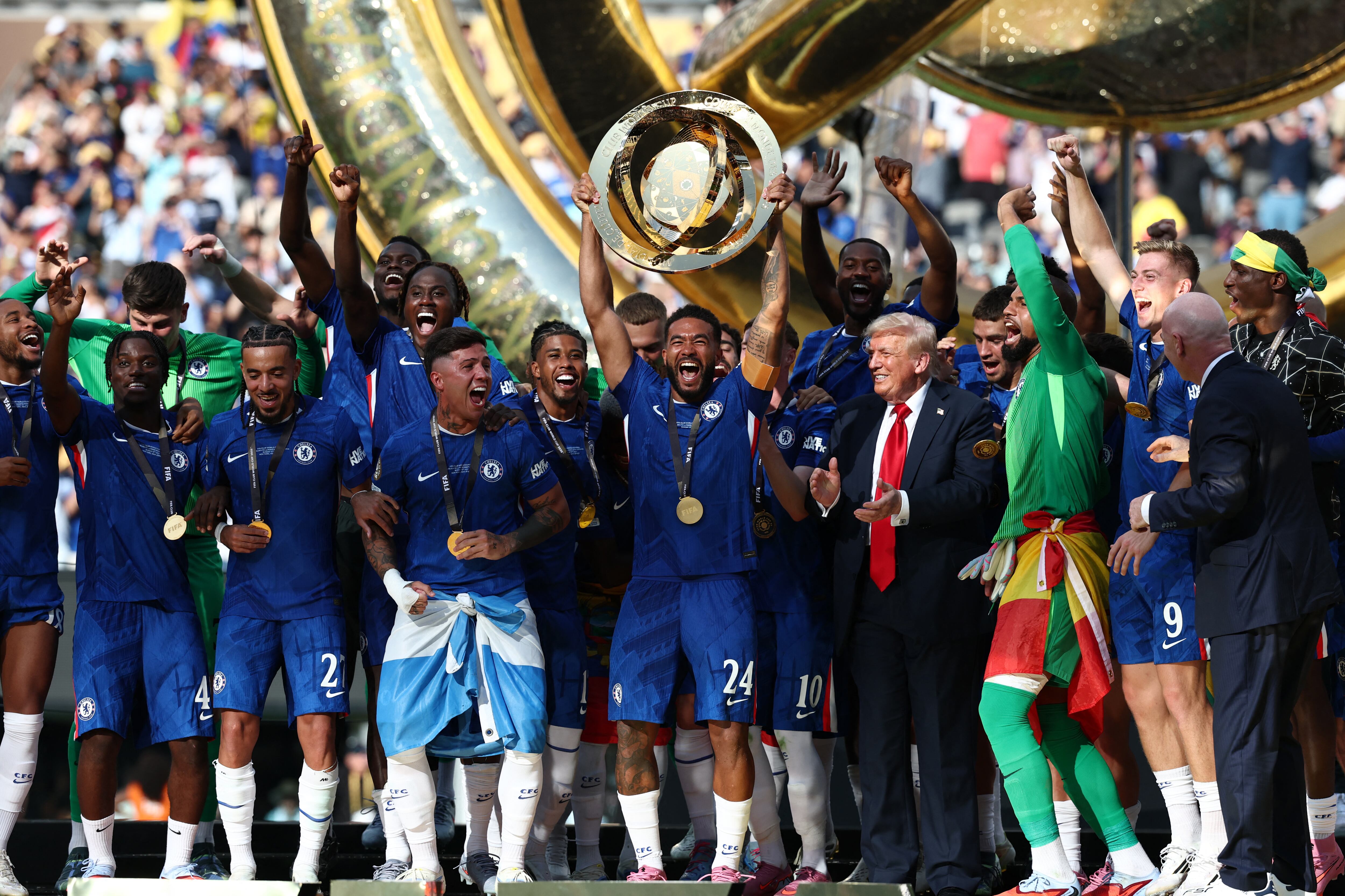  Reece James lifts the trophy with teammates next to US President Donald Trump during the award ceremony for the FIFA Club World Cup 2025 Champions.(Photo by FRANCK FIFE / AFP) (Photo by FRANCK FIFE/AFP via Getty Images)          