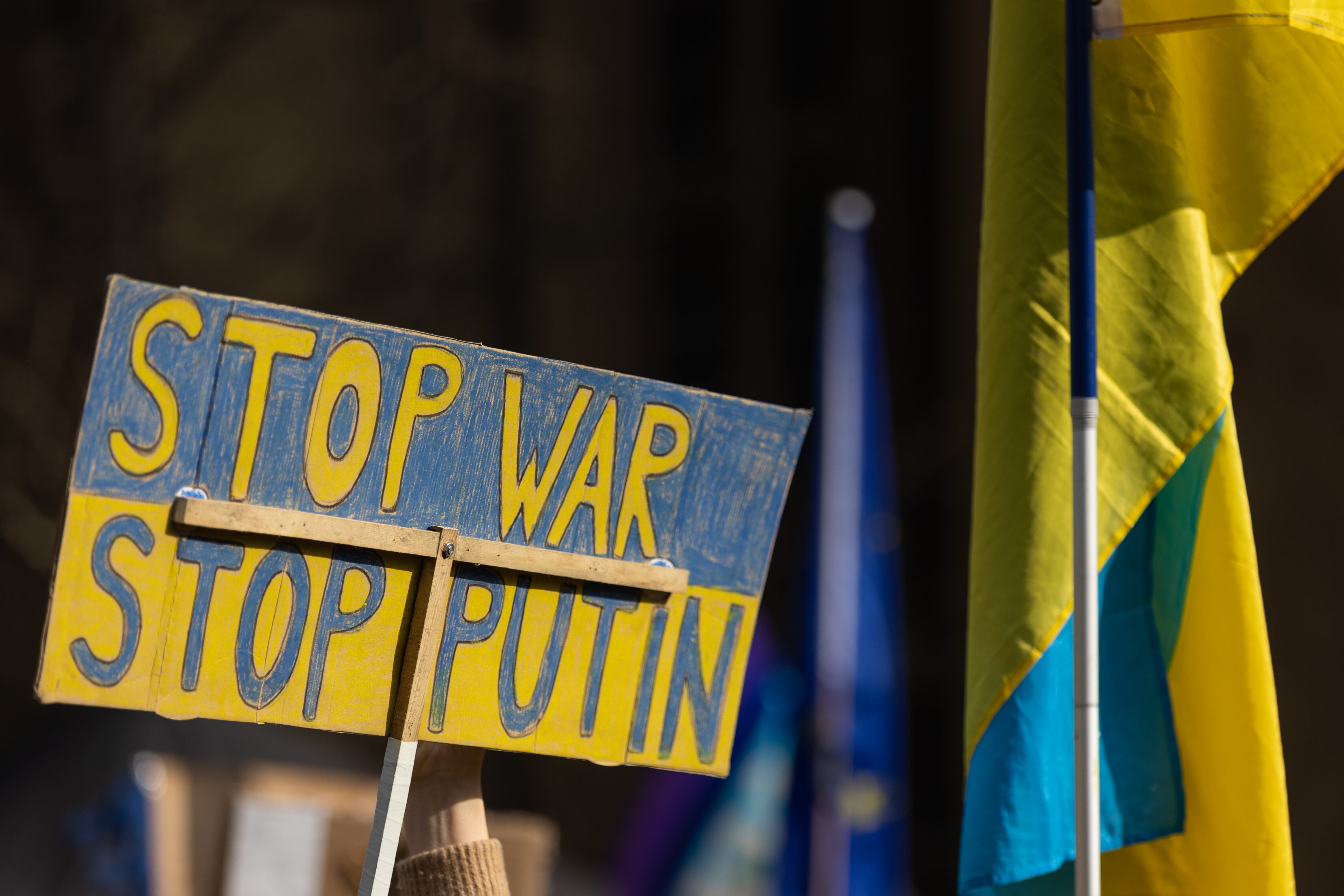 06 March 2022, Hessen, Frankfurt/M.: A participant in the protest action of the citizens' movement Pulse of Europe at the Hauptwache holds a sign with the inscription "Stop War Stop Putin". Thousands of people demonstrated again on Sunday in Hesse against the Russian attack on Ukraine. Photo: Hannes Albert/dpa (Photo by Hannes Albert/picture alliance via Getty Images)