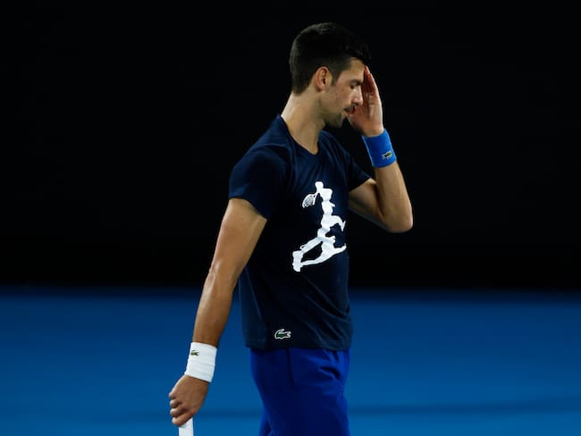MELBOURNE, AUSTRALIA - JANUARY 14: Novak Djokovic of Serbia reacts during a practice session ahead of the 2022 Australian Open at Melbourne Park on January 14, 2022 in Melbourne, Australia. (Photo by Daniel Pockett/Getty Images)