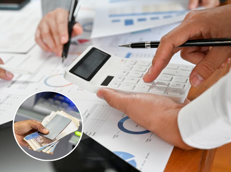 Grupo de contadores analizando las cifras y gráficas del informe financiero (Getty Images)