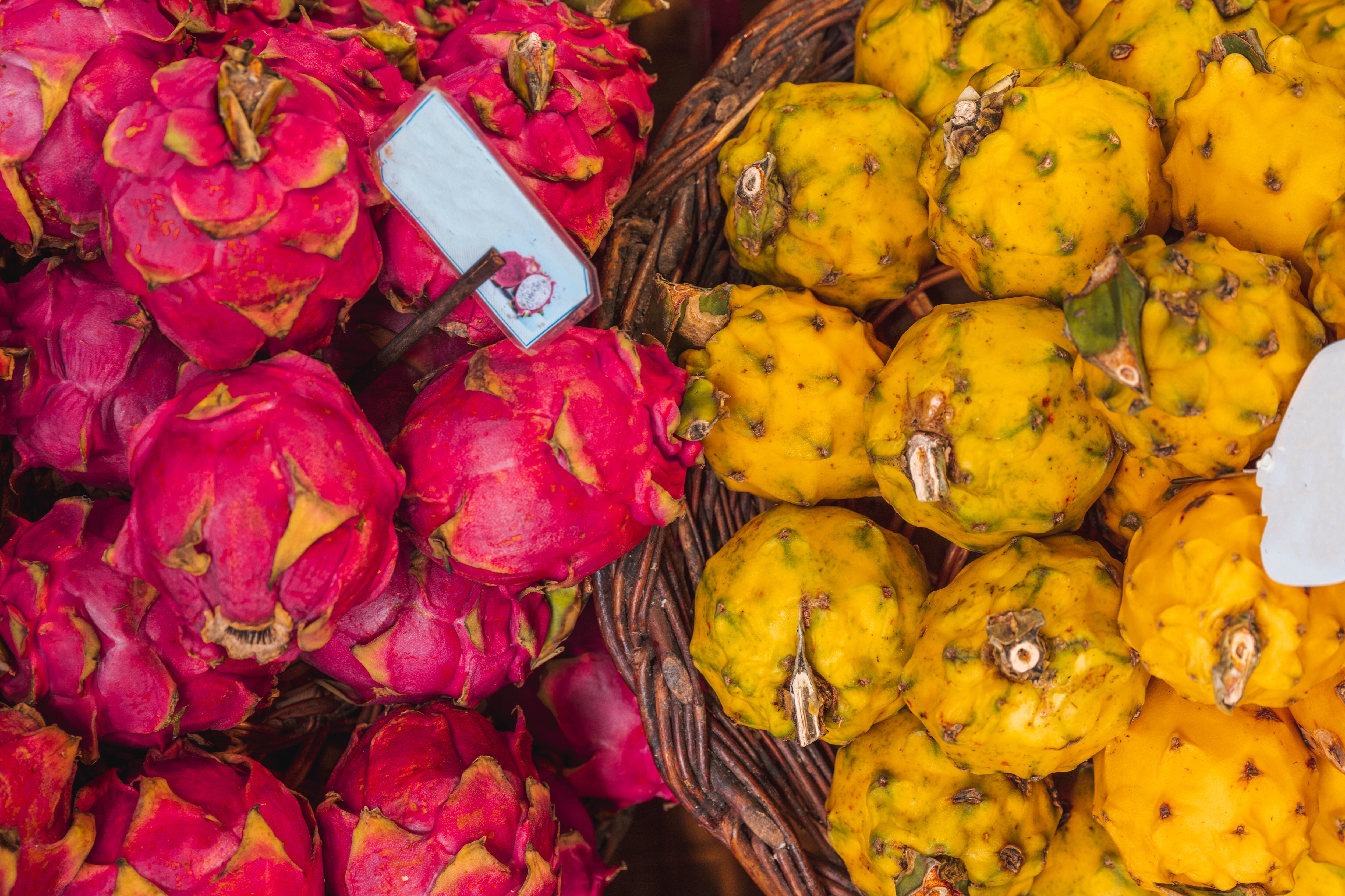 Basket of passion fruits in local market, Madeira, Portugal / Getty Images