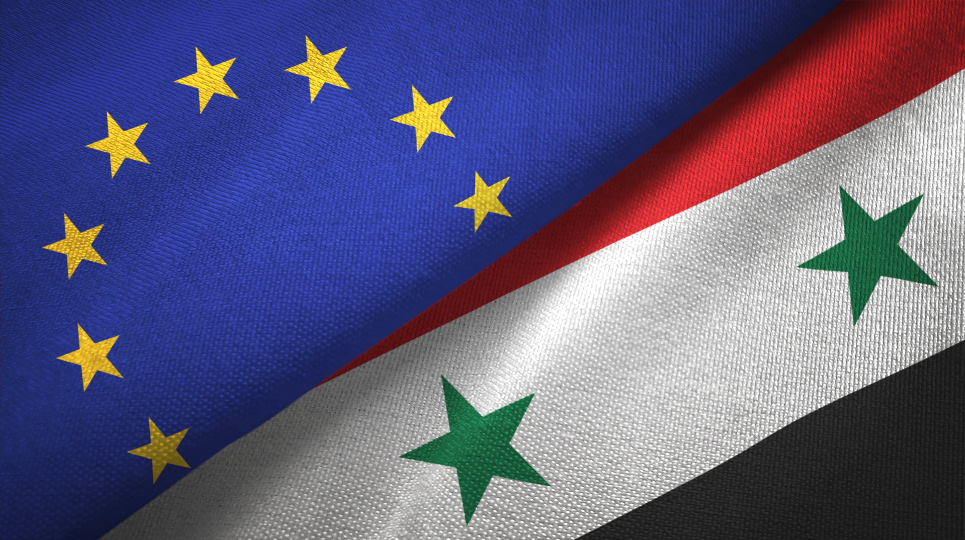 Bandera Unión Europea y Siria. Imagen: Oleksii Liskonih/ Getty Images