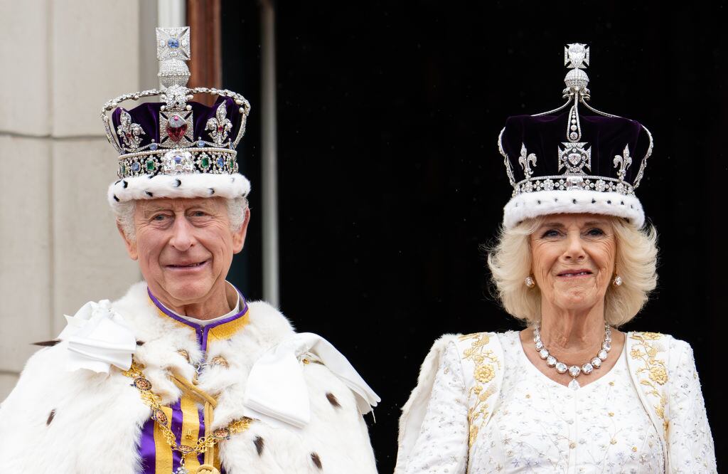 LONDON, ENGLAND - MAY 06: King Charles III and Queen Camilla on the balcony of Buckingham Palace following the Coronation of King Charles III and Queen Camilla on May 06, 2023 in London, England. The Coronation of Charles III and his wife, Camilla, as King and Queen of the United Kingdom of Great Britain and Northern Ireland, and the other Commonwealth realms takes place at Westminster Abbey today. Charles acceded to the throne on 8 September 2022, upon the death of his mother, Elizabeth II. (Photo by Pool/Samir Hussein/WireImage)