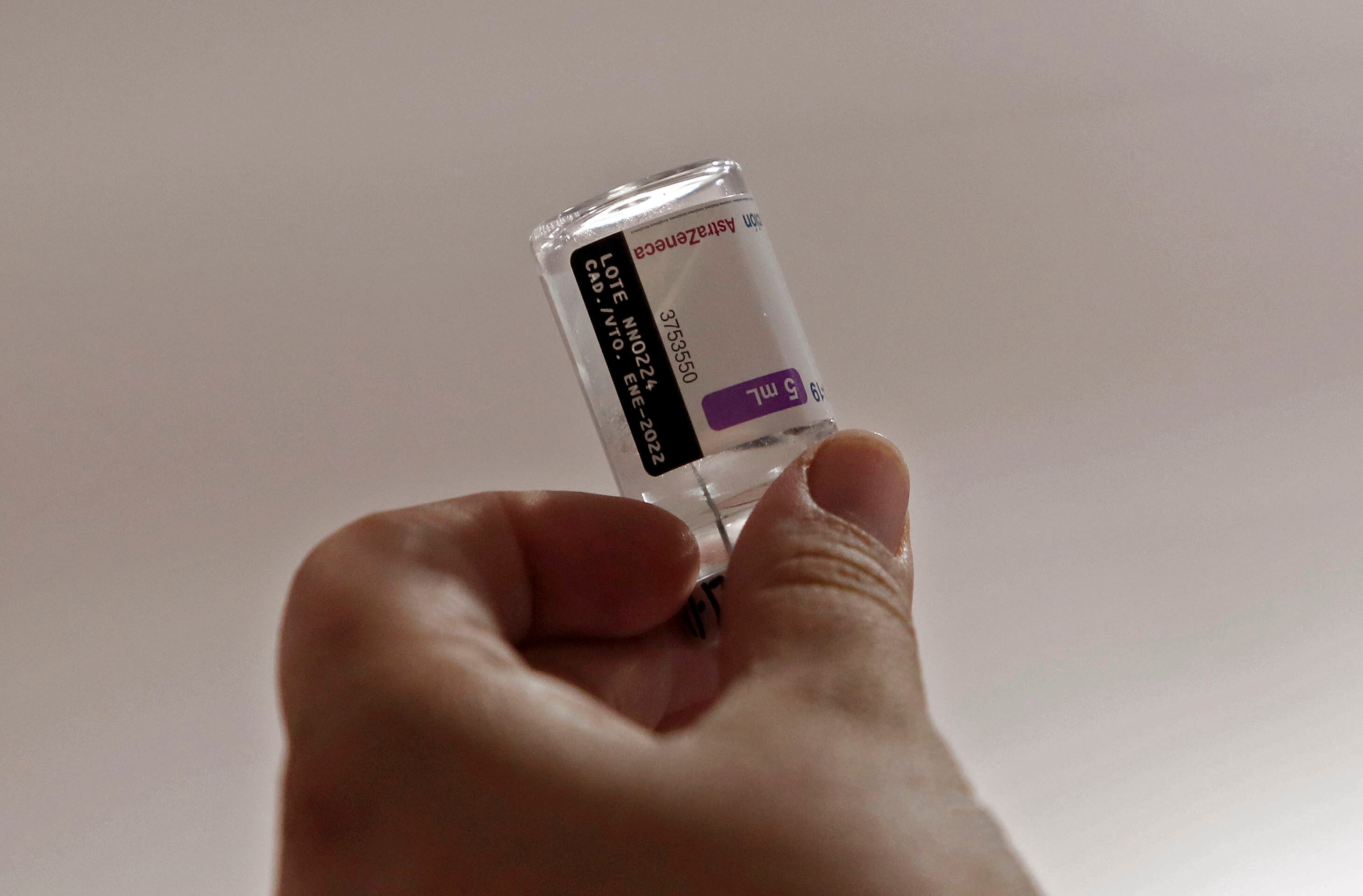 A nurse prepares a dose of an AstraZeneca vaccine against COVID-19 at a vaccination point in Bogota, on December 21, 2021. - Colombian health authorities detected the first three cases of the Omicron variant of COVID-19 in passengers who arrived from the US and Spain. (Photo by DANIEL MUNOZ / AFP) (Photo by DANIEL MUNOZ/AFP via Getty Images)