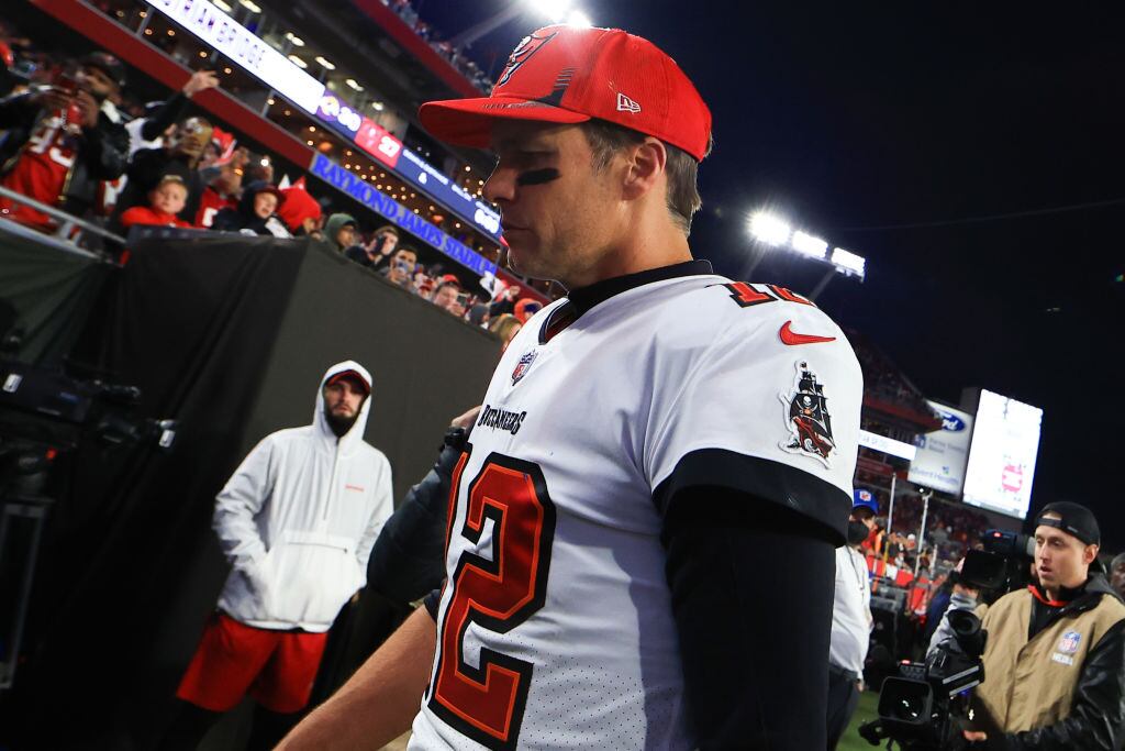 TAMPA, FLORIDA - JANUARY 23: Tom Brady #12 of the Tampa Bay Buccaneers reacts after being defeated by the Los Angeles Rams 30-27 in the NFC Divisional Playoff game at Raymond James Stadium on January 23, 2022 in Tampa, Florida. (Photo by Mike Ehrmann/Getty Images)