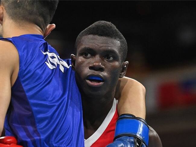 Boxeadores Ryomei Tanaka y Yuberjen Martínez en los cuartos de final de los Juegos Olímpicos Tokio 2020. Foto: LUIS ROBAYO/POOL/AFP via Getty Images