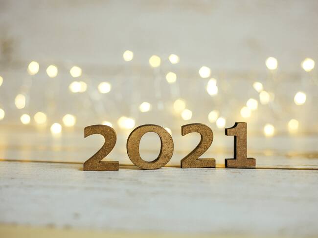 2021 New Year Number. Festive Card with blurred fairy lights and white shiny background.