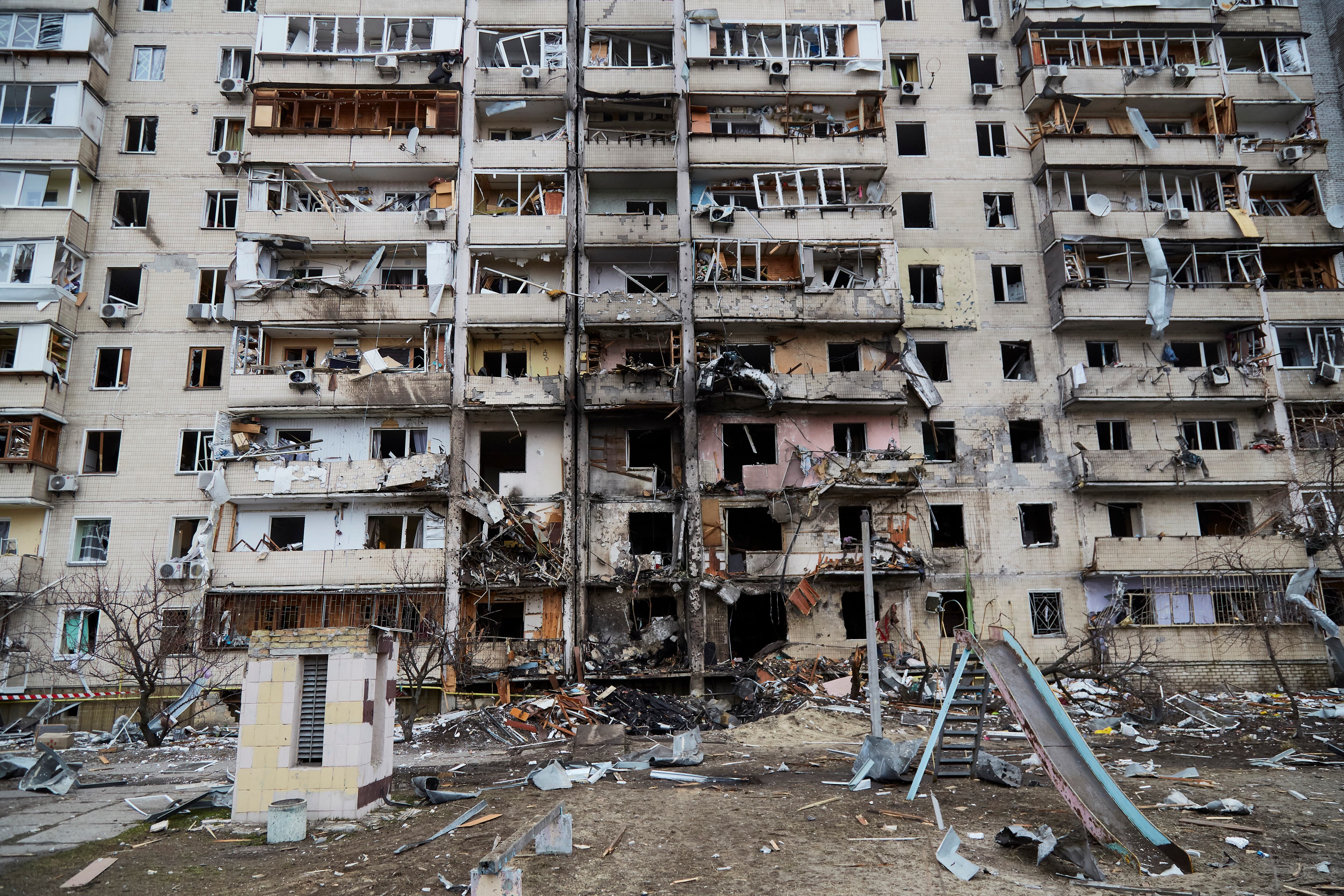 KYIV, UKRAINE - FEBRUARY 25: A residential building damaged by a missile on February 25, 2022 in Kyiv, Ukraine. Yesterday, Russia began a large-scale attack on Ukraine, with Russian troops invading the country from the north, east and south, accompanied by air strikes and shelling. The Ukrainian president said that at least 137 Ukrainian soldiers were killed by the end of the first day.  (Photo by Pierre Crom/Getty Images)