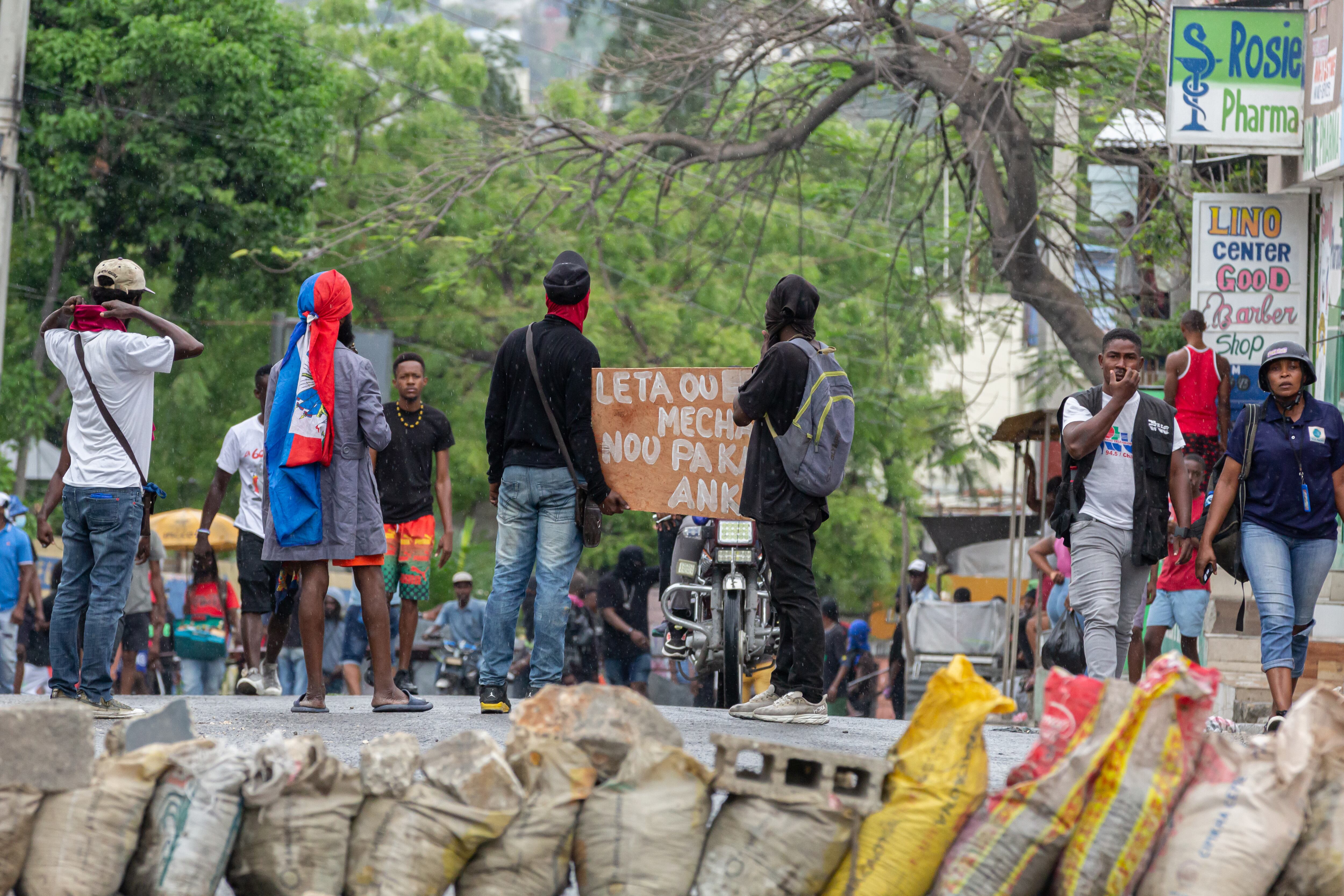 PORT-AU-PRINCE, HAITI - APRIL 16: A view of the barricaded streets as growing insecurity, particularly in the capital, is forcing families to flee their former shelters on several occasions in Port-au-Prince, Haiti on April 16, 2025. The citizens' demonstration scheduled for this Wednesday in Canap-Vert was canceled, as thousands of people prepared to take to the streets to protest against insecurity. According to IOM data, over one million Haitians are currently internally displaced - a figure three times higher than in 2023. Growing insecurity, particularly in the capital, is forcing families to flee repeatedly, often at the cost of deplorable living conditions, with no access to drinking water, healthcare or decent shelter. (Photo by Guerinault Louis/Anadolu via Getty Images)