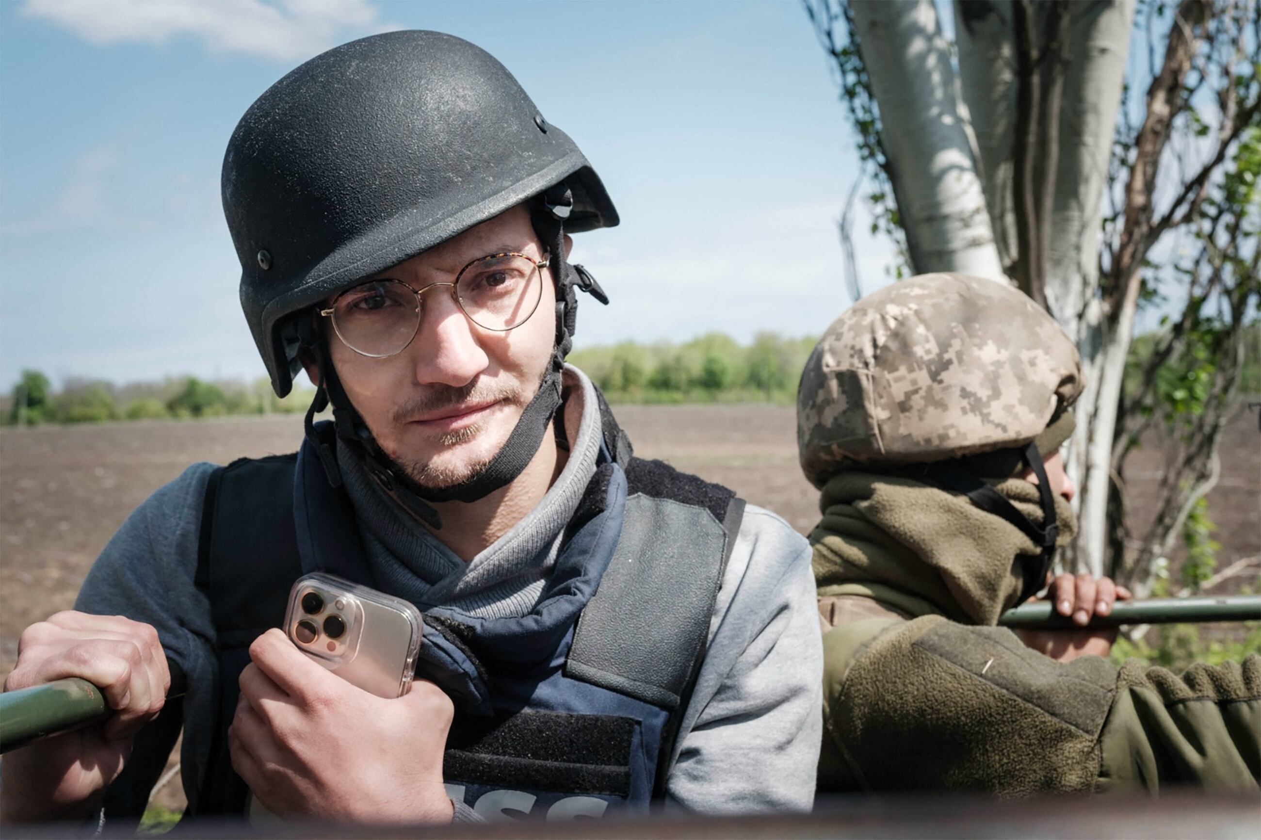 AFP visual journalist Arman Soldin is pictured on a Ukrainian military truck during an assignment for AFP in Donbass on April 30, 2022. Arman was killed by a rocket strike as he reported with AFP colleagues from Ukrainian positions in Chasiv Yar on May 9, 2023. Arman, who was 32 and born in Bosnia, began his career as an AFP intern in the Rome bureau before moving to London in 2015. He was formally appointed as Ukraine video coordinator for AFP based in Kyiv in September 2022. Arman's death is a terrible reminder of the risks and dangers of covering this war. Our thoughts tonight are with his family and friends, and with all AFP people on the ground in Ukraine. (Photo by Yasuyoshi CHIBA / AFP)