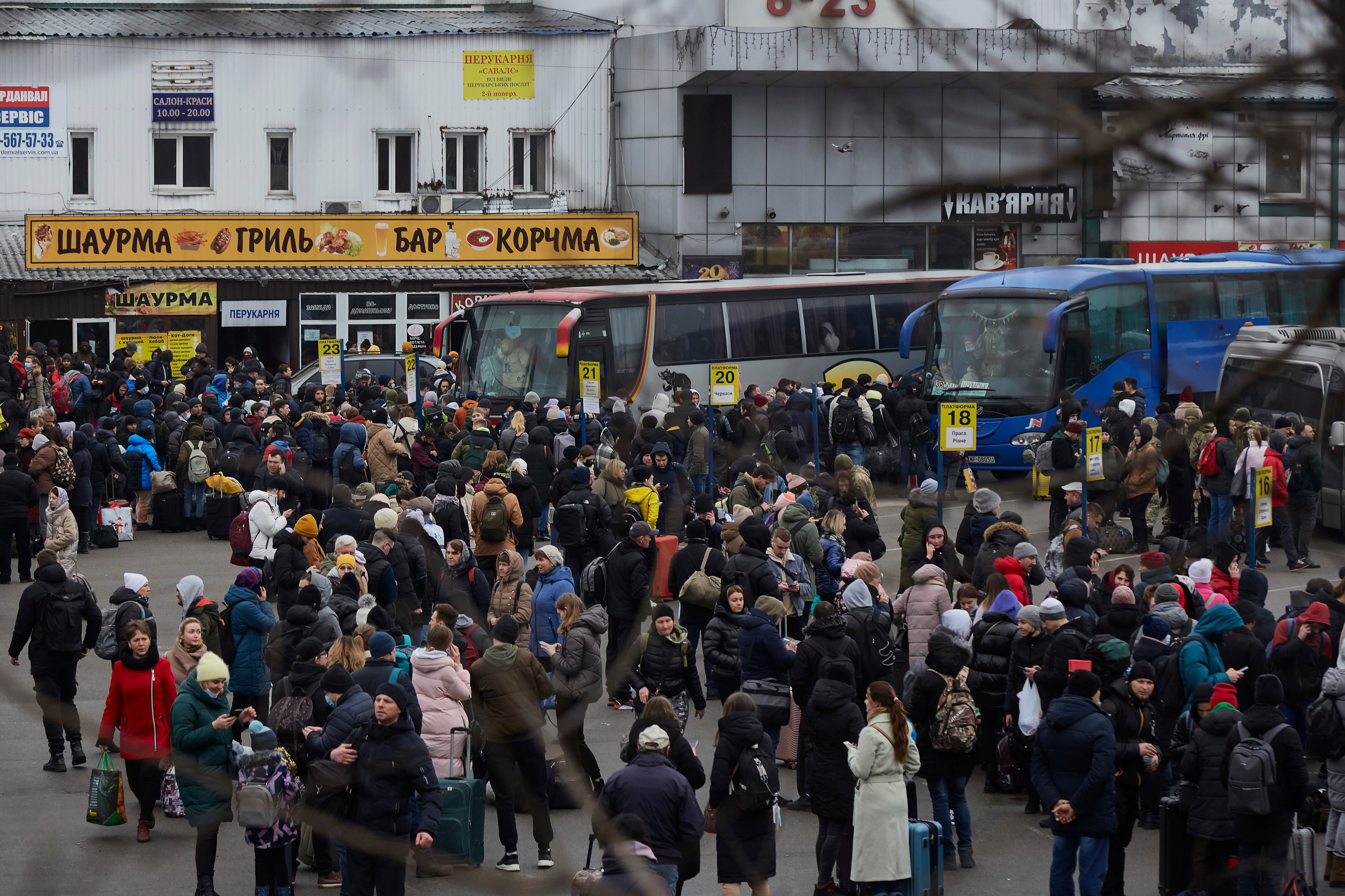 KYIV, UKRAINE - FEBRUARY 24: People wait for buses at a bus station as they attempt to evacuate the city on February 24, 2022 in Kyiv, Ukraine. Overnight, Russia began a large-scale attack on Ukraine, with explosions reported in multiple cities and far outside the restive eastern regions held by Russian-backed rebels. (Photo by Pierre Crom/Getty Images)