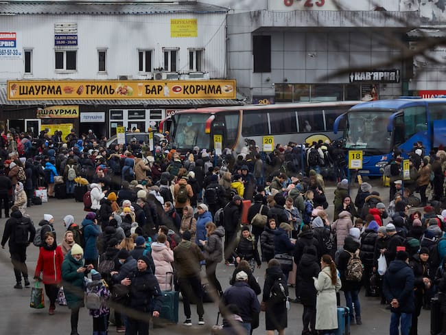 KYIV, UKRAINE - FEBRUARY 24: People wait for buses at a bus station as they attempt to evacuate the city on February 24, 2022 in Kyiv, Ukraine. Overnight, Russia began a large-scale attack on Ukraine, with explosions reported in multiple cities and far outside the restive eastern regions held by Russian-backed rebels. (Photo by Pierre Crom/Getty Images)