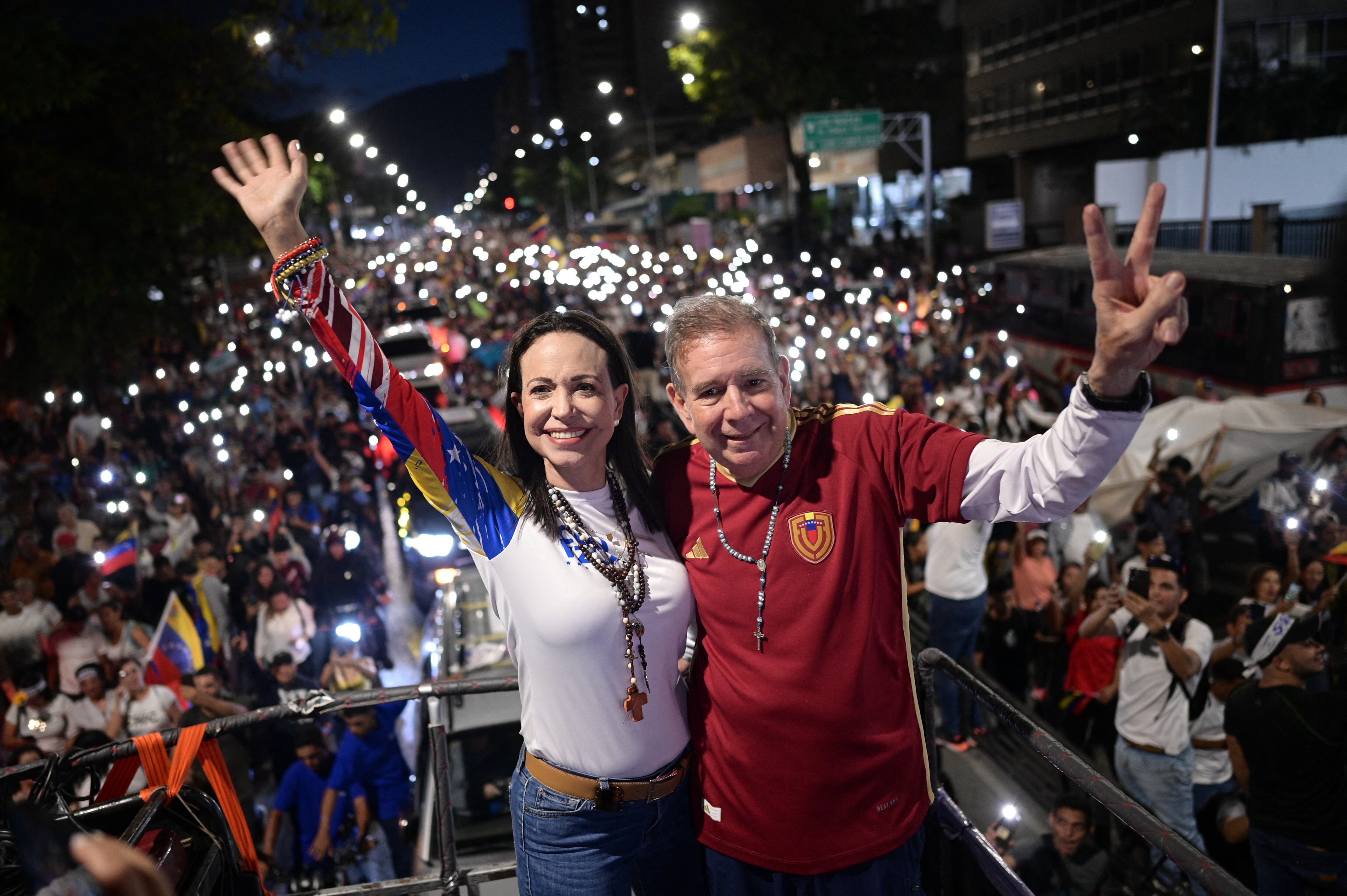 TOPSHOT - Venezuelan Presidential candidate Edmundo Gonzalez and opposition leader Maria Corina Machado attend a campaign rally in Caracas on July 4, 2024. Campaigning for July 28 presidential elections officially opened in Venezuela amid great uncertainty July 4, 2024, with incumbent Nicolas Maduro accused of political persecution. (Photo by Gabriela ORAA / AFP) (Photo by GABRIELA ORAA/AFP via Getty Images)