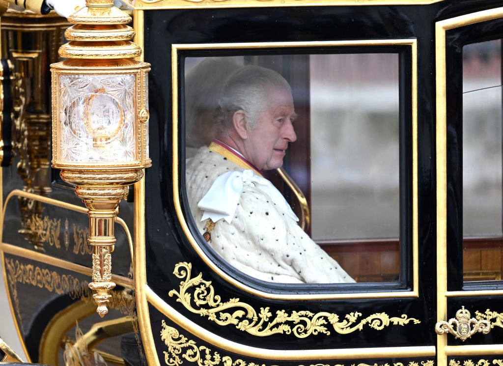LONDON, ENGLAND - MAY 06: King Charles III and Camilla, Queen Consort travelling in the Diamond Jubilee Coach built in 2012 to commemorate the 60th anniversary of the reign of Queen Elizabeth II, flanked by over a thousand Armed Forces route liners and The Sovereign’s Escort of the Household Cavalry sets off along the Mall from Buckingham Palace on route to Westminster Abbey for the Coronation of King Charles III and Queen Camilla on May 06, 2023 in London, England. The Coronation of Charles III and his wife, Camilla, as King and Queen of the United Kingdom of Great Britain and Northern Ireland, and the other Commonwealth realms takes place at Westminster Abbey today. Charles acceded to the throne on 8 September 2022, upon the death of his mother, Elizabeth II. (Photo by Samir Hussein/WireImage)